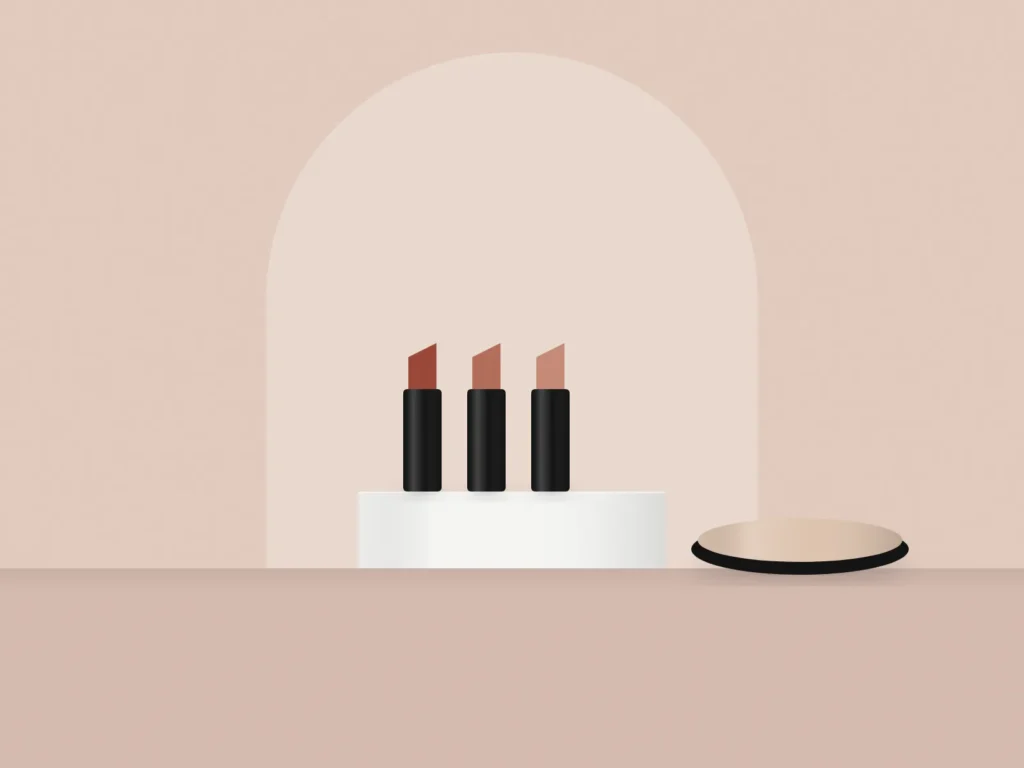 Lipsticks and a compact on a plinth